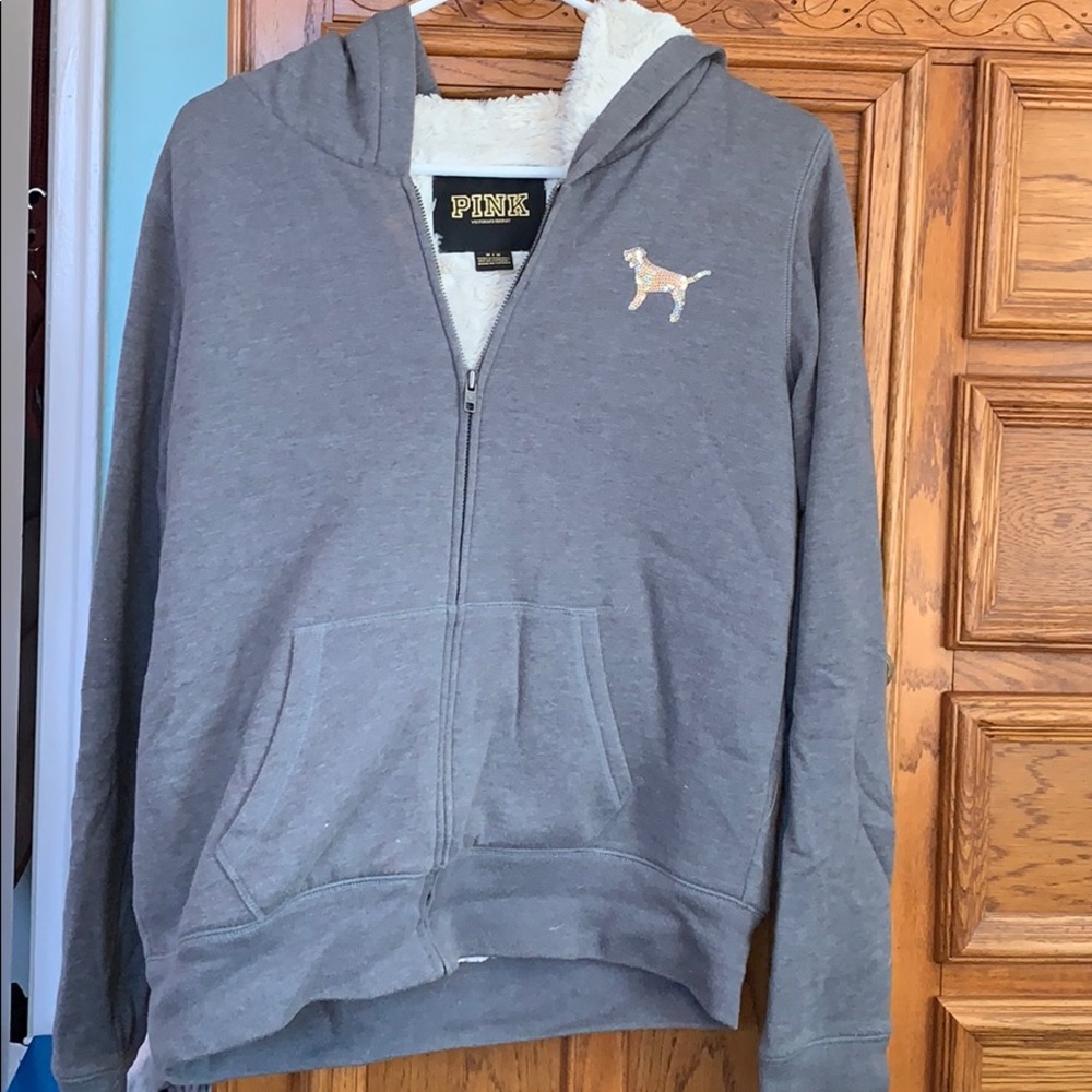 A grey pink fury sweatshirt